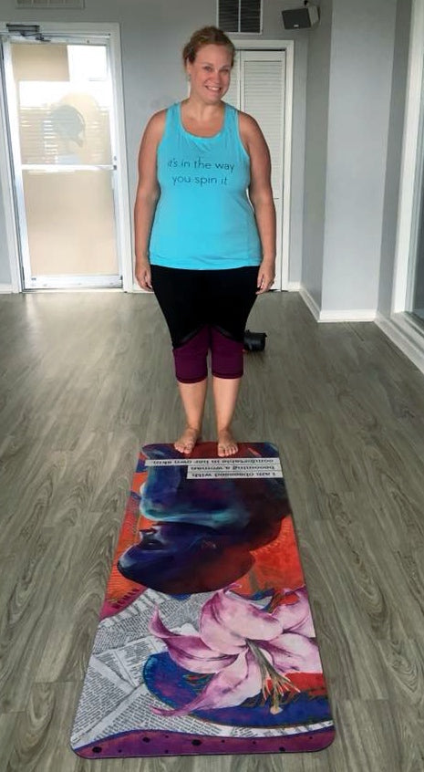 Kathy standing with her mat