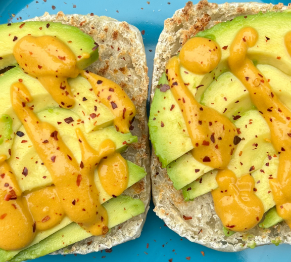 Vegan Cheesy Avocado Toast on an English Muffin