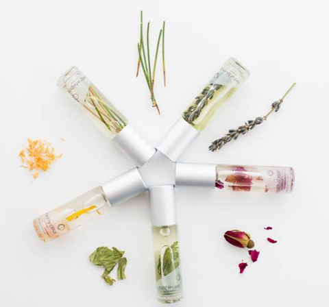 Inkling scents mini roll-on perfumes arranged in a flower. Available at well&belle