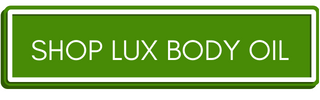 Green button with link to shop lux body oil by Herb Market Botanicals on well&belle