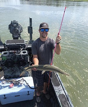 bowfishing for gar with bow and arrow