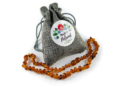 amber teething necklace in a jute bag, made in poland, polish baltic amber, cognac beads