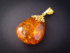 gold plated pendant with cognac amber