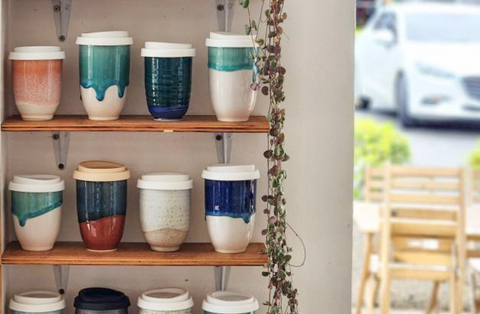 Travel Cups Stacked On A Shelf