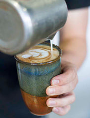 Reusable ceramic cup in cafe