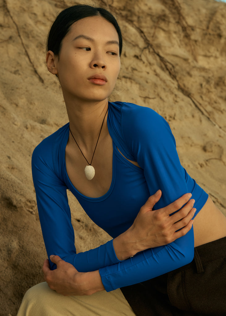 hakea x handsom cobalt blue long sleeve swimwear top and shell necklace