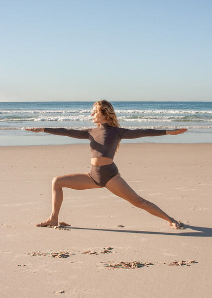 Flexible woman doing yoga on beach - a Royalty Free Stock Photo from  Photocase