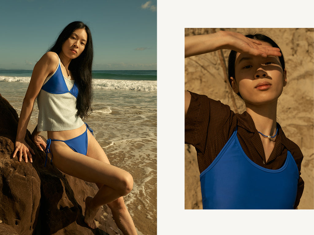 cobalt blue bikini layered over handsom baby blue single and brown shirt at the beach