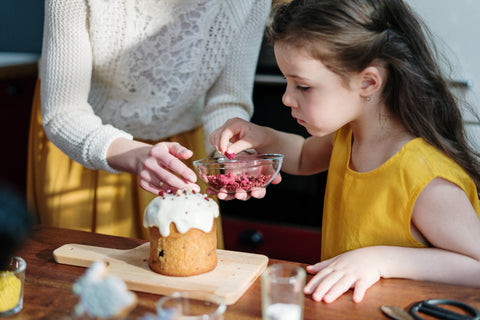 girl baking with mom