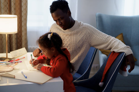 kids writing letters with dad
