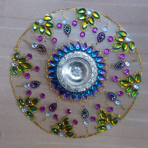 a gem-encrusted old CD suncatcher