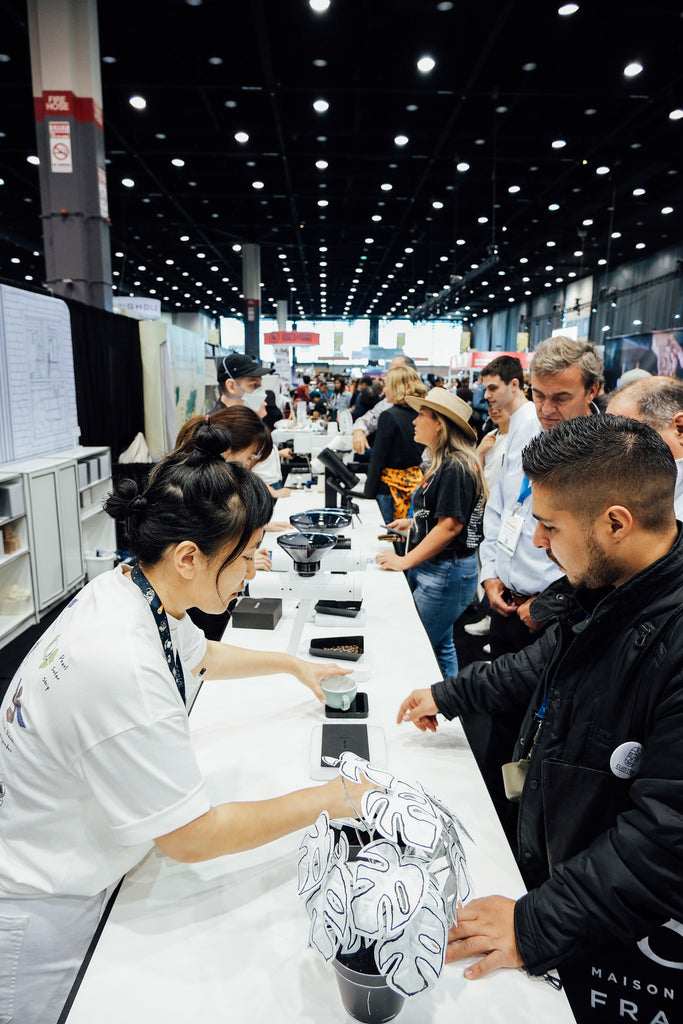 Acaia team members demoing Acaia products at the booth.