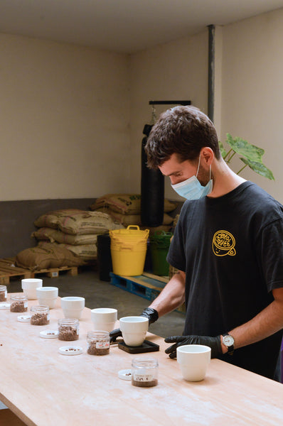 Cupping coffee at Hola Coffee