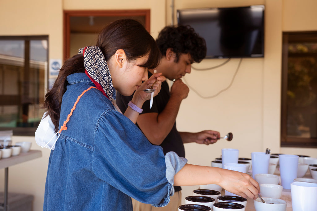 Bean Voyage owners cupping coffee