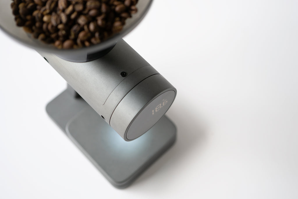 An Orion Nano from above, holding coffee beans in the hopper