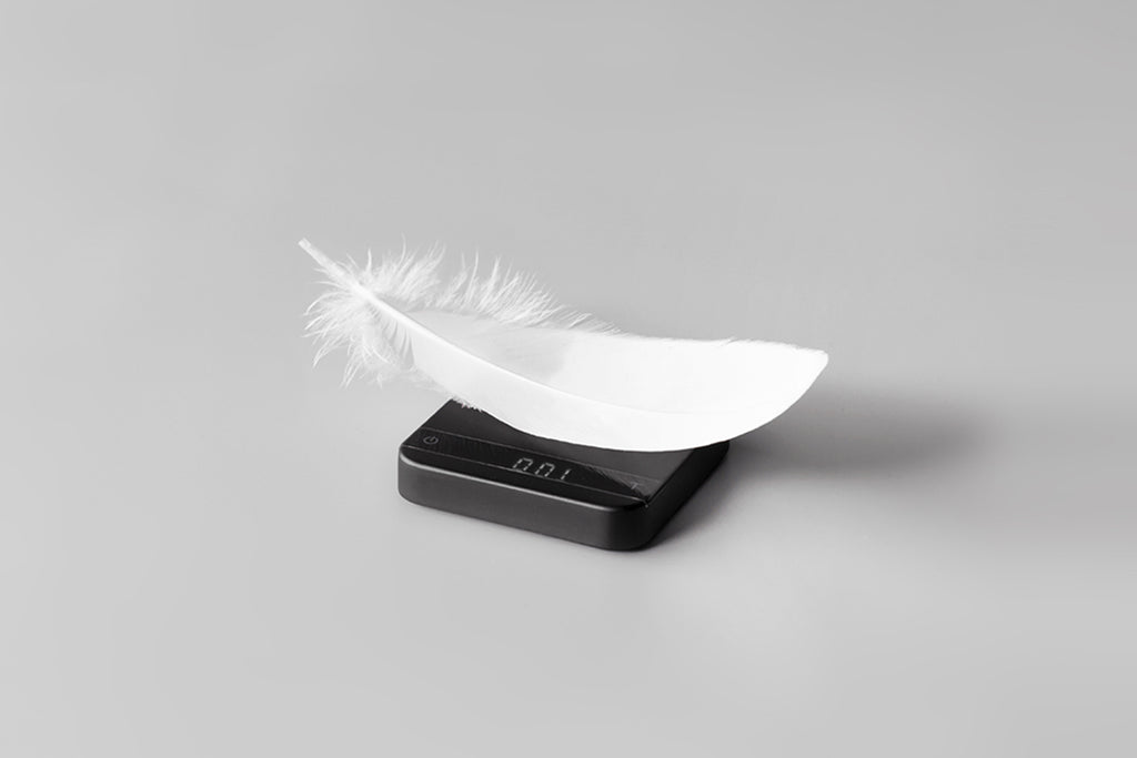 Photo of Pyxis scale weighing a feather