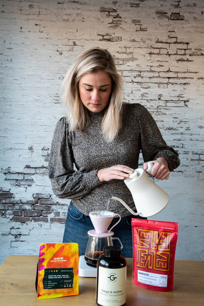 Sam brewing with a white Acaia Pearl scale 