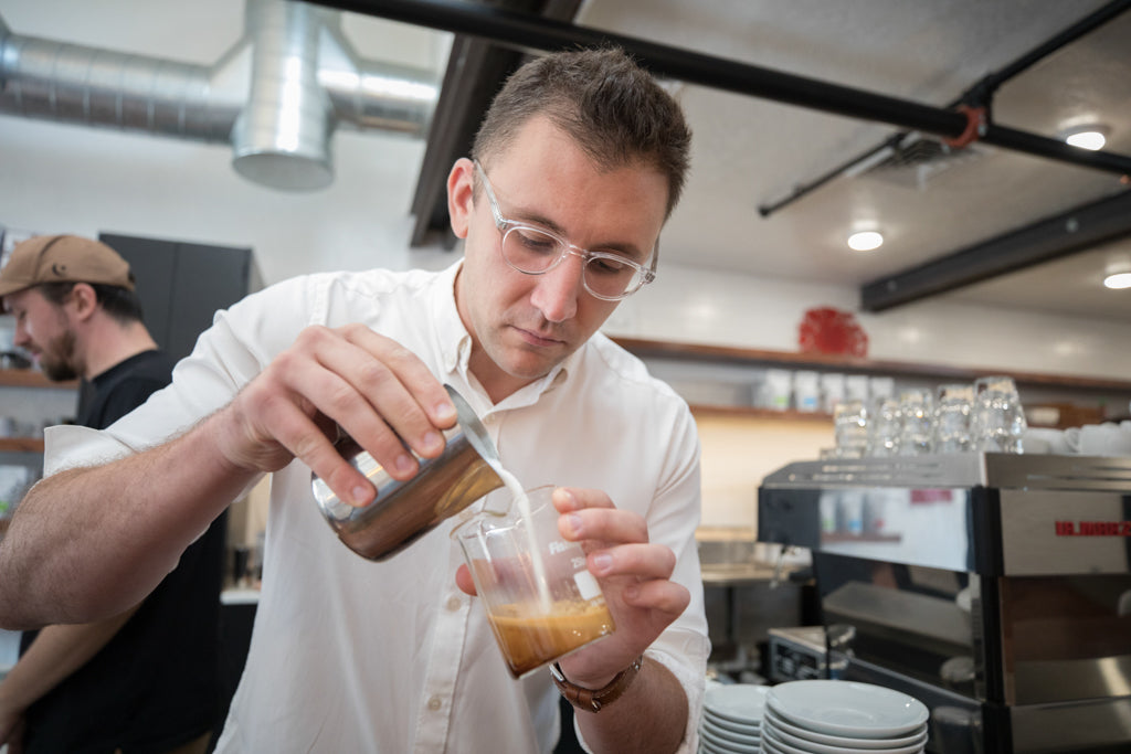 Christopher Hendon pouring a drink 