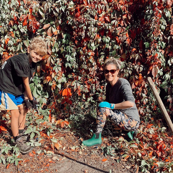 mother and son gardening outside