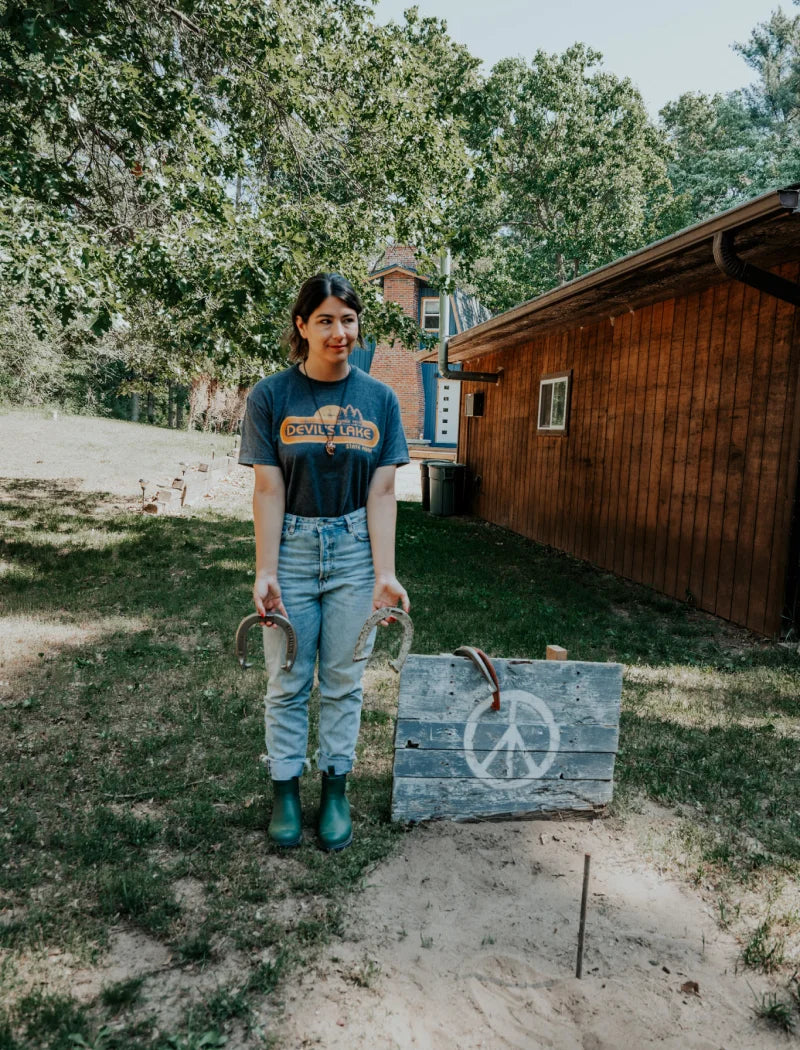 cabin girl beside a peace sign