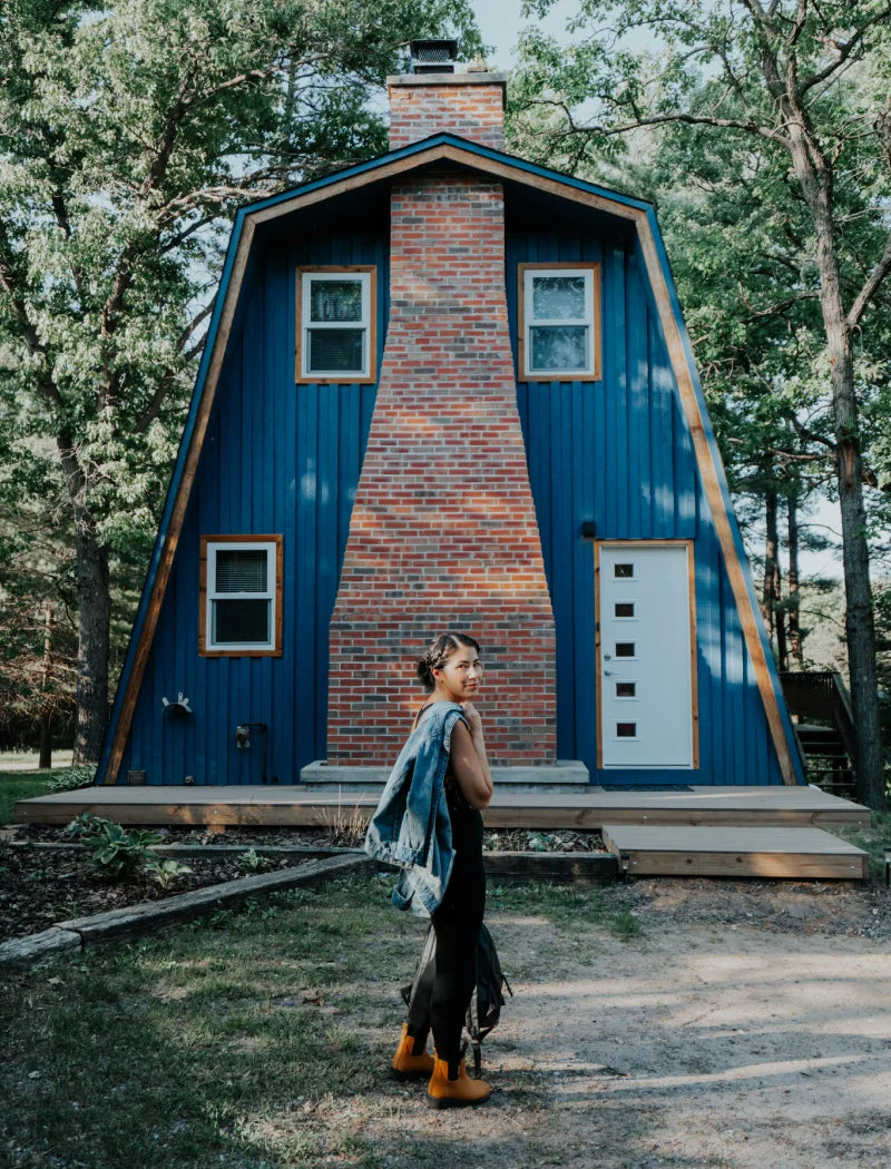 cabin girl in front of the cabin