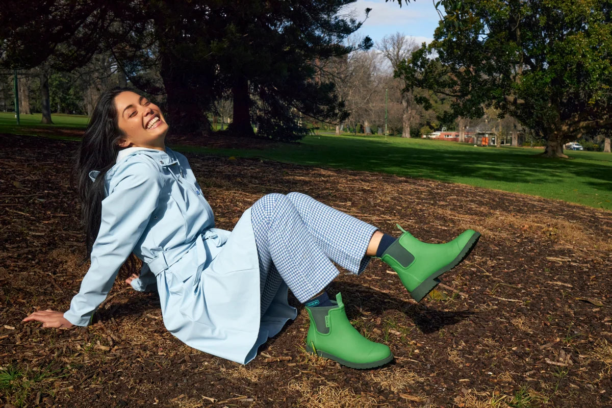 grass hopper green boots on jeans and coat