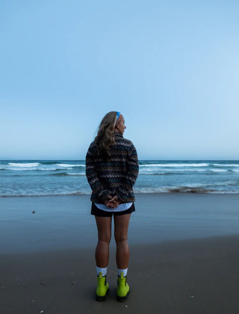 green boots by the beach