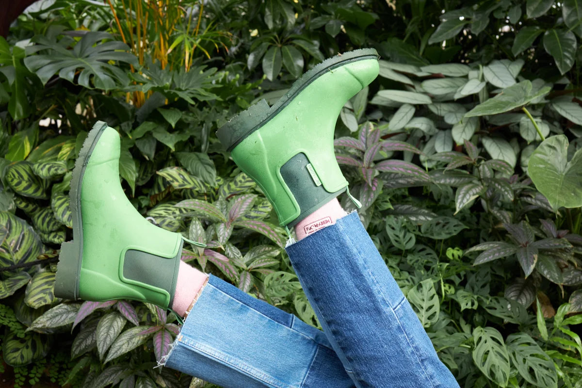 green boots on jeans