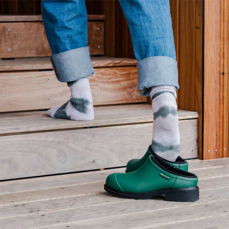 green clogs and socks