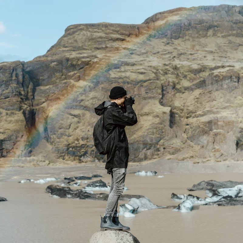 taking photos on a rock