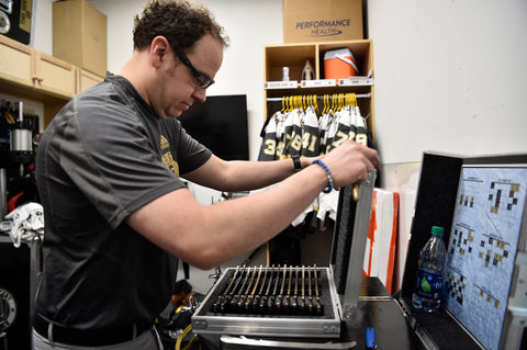 Vegas Golden Knight's Head Equipment Manager, Chris Davidson-Adams, preparing skate blades for the team