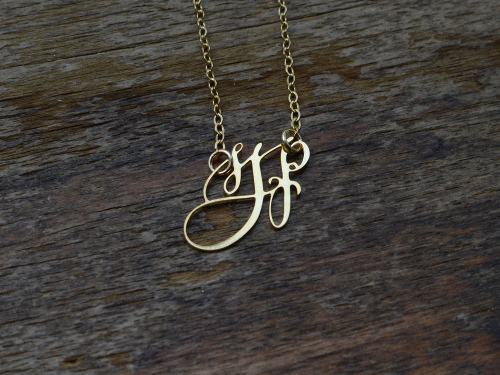 custom gold monogram necklace hand lettered by a calligrapher