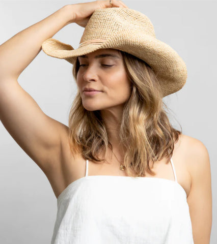 Trendy cowboy hat are timeless for your beachy outfits.