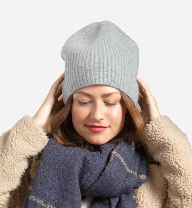 Woman wearing cashemere beanie and scarf.