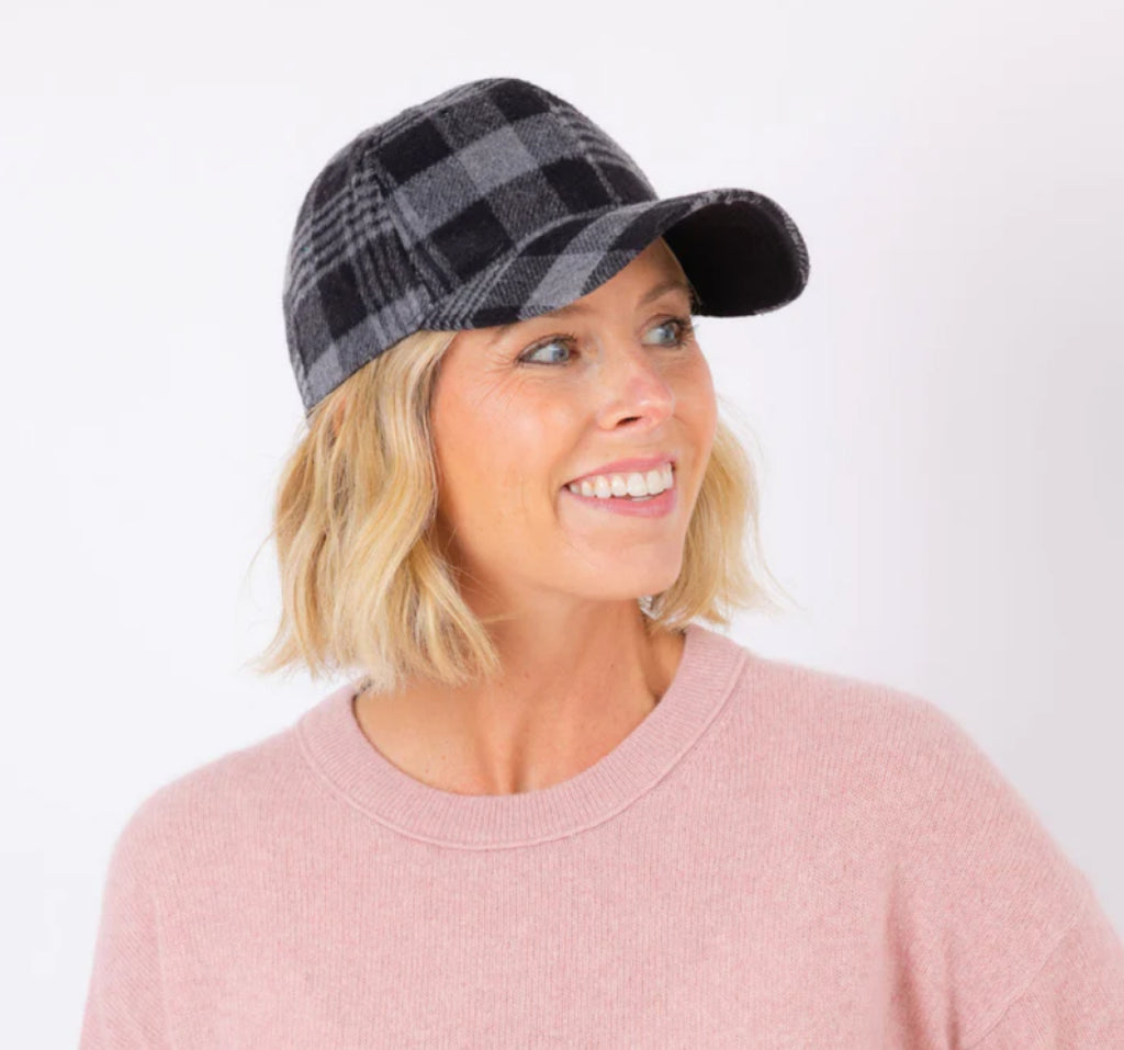 Blonde woman wearing fall cap hat.