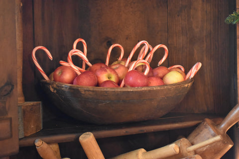 apple basket with candy canes