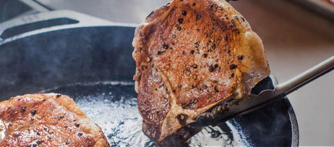 Searing pork chop in cast iron pan