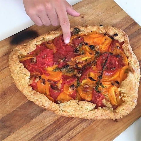 My son ready to eat the tomato crostata