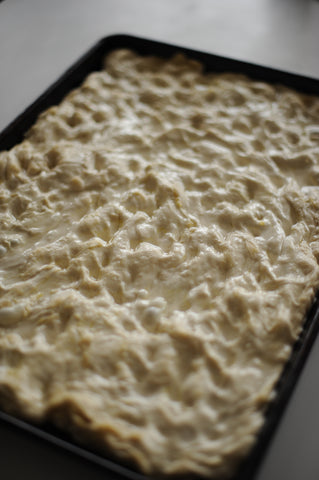 Focaccia during proof with salt brine