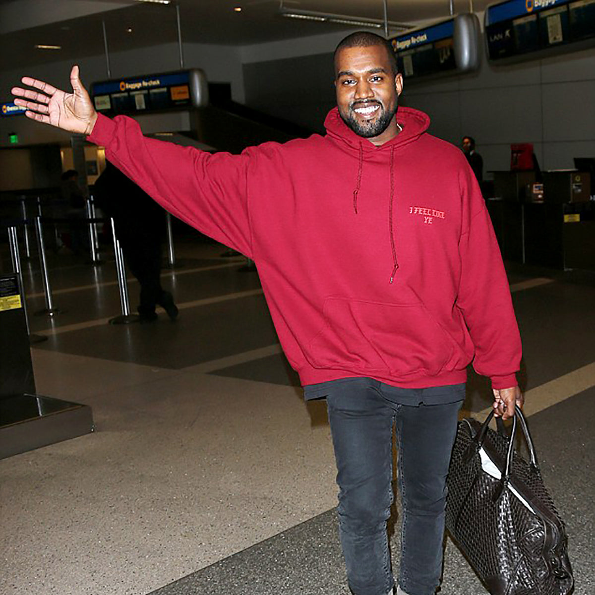 kanye_20west_20all_20smiles_20as_20he_20arrives_20at_20lax_20airport-1200x1200_1024x1024@2x.jpg