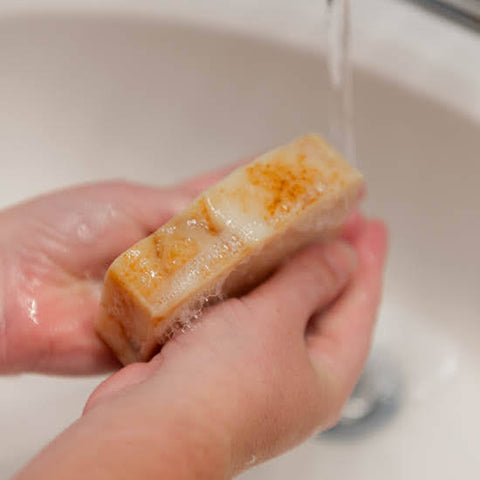 Washing hands with Tea Tree Goat Milk Soap