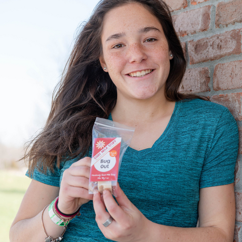 Jade holding Bug Out Goat Milk Soap