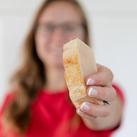 Ashton holding Tea Tree Goat Milk Soap