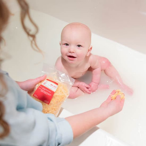 Michael in the bath with milk bath soap shreds