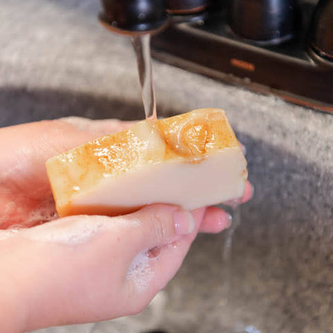 Washing hands with Tea Tree Goat Milk Soap