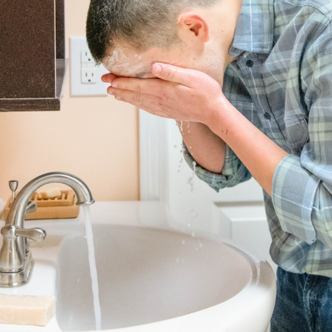 Hewitt washing his face with Purity Goat Milk Soap