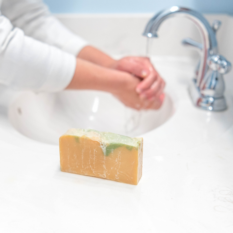 Washing hands with Rosemary Mint Goat Milk Soap