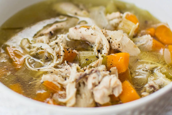 A bowl of warming chicken and vegetable soup