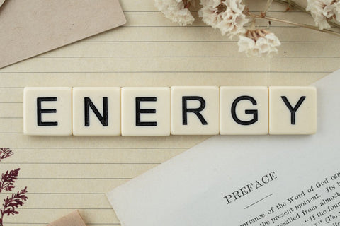 the word energy spelled out using scrabble tiles to represent that good hydration can improve energy levels