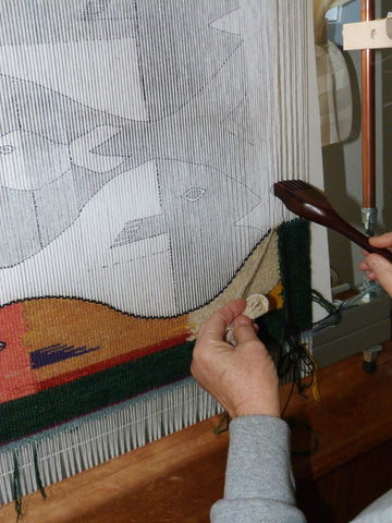 fish tapestry being woven